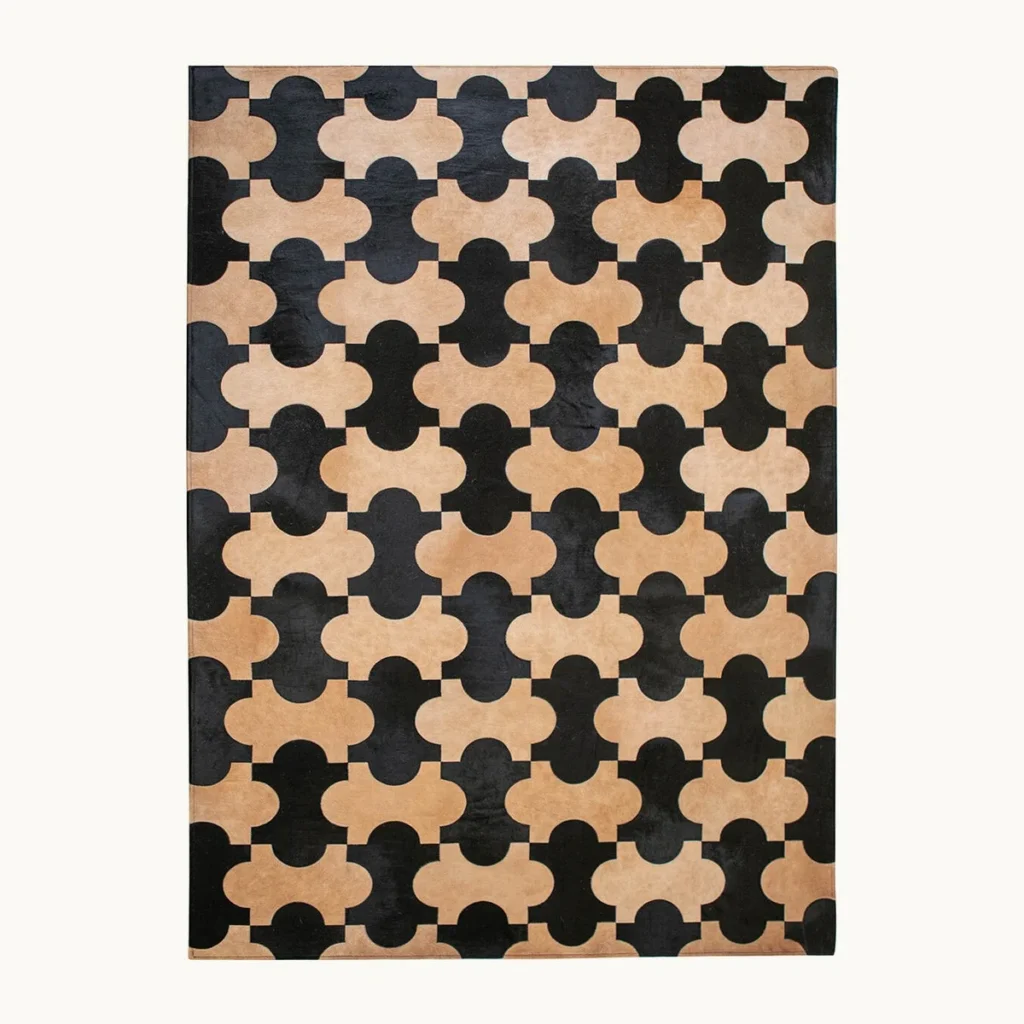 Premium Cowhide Quatrefoil Rug in Black and Sand — front view