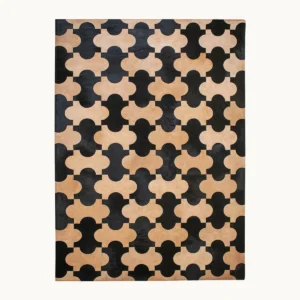 Premium Cowhide Quatrefoil Rug in Black and Sand — front view