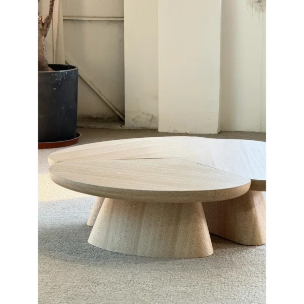 Petal Three-Piece Round Coffee Table in natural oak — in a room setting