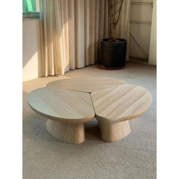 Petal Three-Piece Round Coffee Table in natural oak — in a room setting