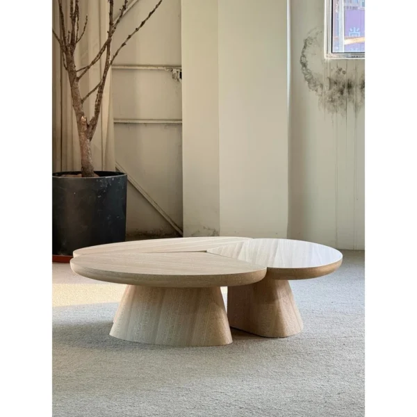 Petal Three-Piece Round Coffee Table in natural oak — in a room setting