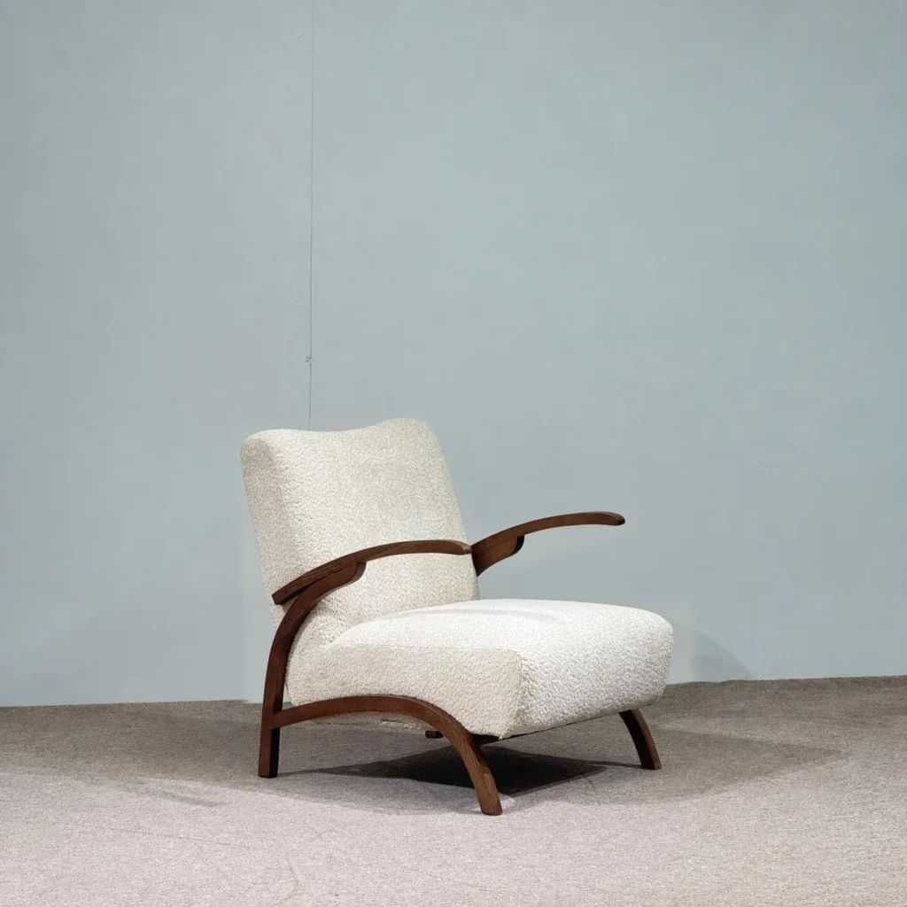 Pure White Bouclé Lounge Chair with Black Walnut Arms in ivory — front view