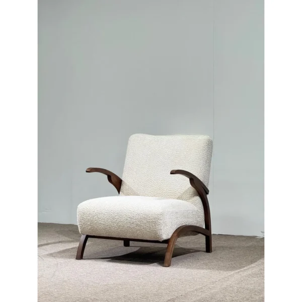 Pure White Bouclé Lounge Chair with Black Walnut Arms in ivory — in a room setting