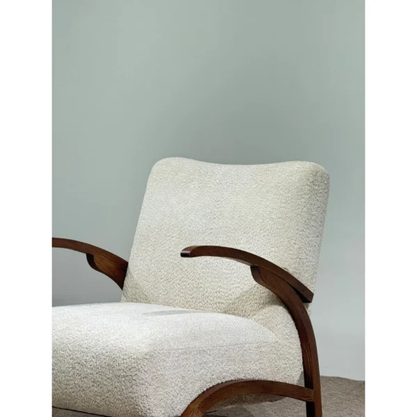 Pure White Bouclé Lounge Chair with Black Walnut Arms in ivory — in a room setting