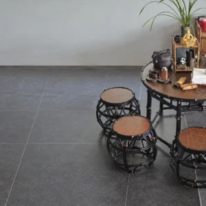 Purple Bamboo Round Table with Drum Stools in clay — in a room setting