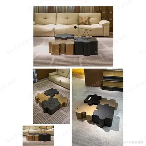 Modular Puzzle Coffee Table in Brass and Dark Wood — in a room setting