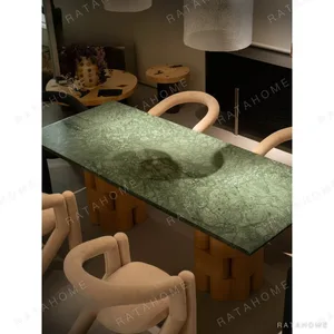 Indian Green Stone Dining Table on Woven Ash Column Legs in olive — in a room setting