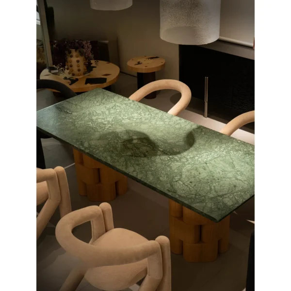 Indian Green Stone Dining Table on Woven Ash Column Legs in olive — in a room setting