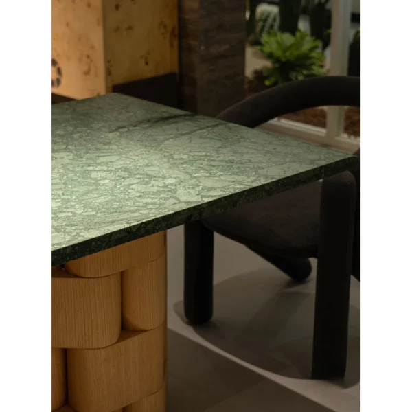 Indian Green Stone Dining Table on Woven Ash Column Legs in olive — in a room setting