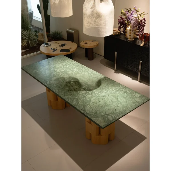 Indian Green Stone Dining Table on Woven Ash Column Legs in olive — in a room setting
