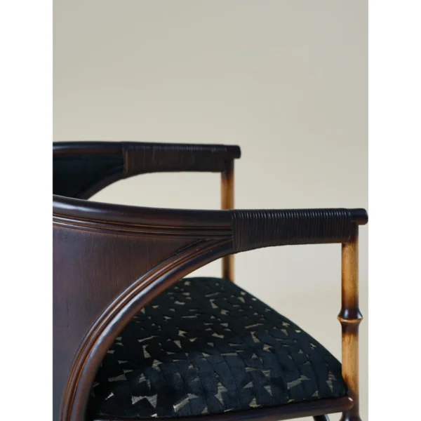 Qionglan Bamboo and Rattan Barrel Chair in black — in a room setting