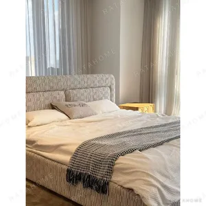 Slim Curved Headboard Bed in Patterned Linen — in a room setting