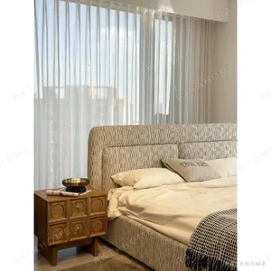 Slim Curved Headboard Bed in Patterned Linen — in a room setting