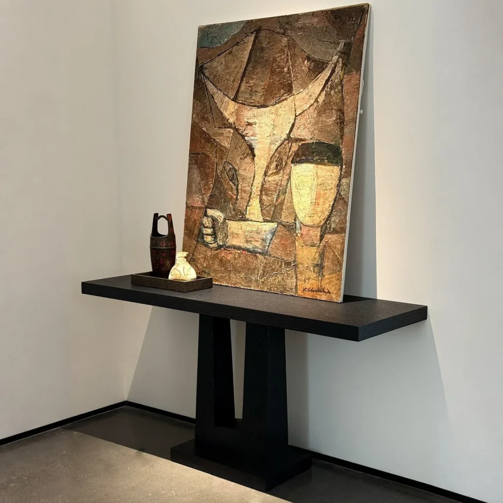 Garien Charred Black Oak Console Table in black — front view
