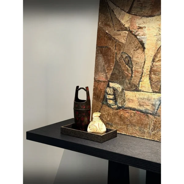 Garien Charred Black Oak Console Table in black — in a room setting