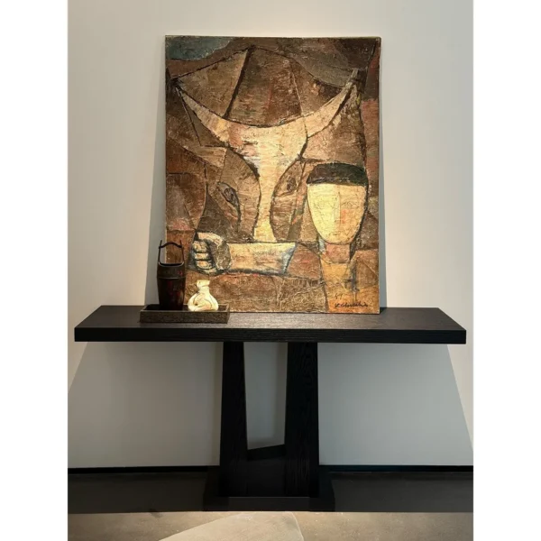 Garien Charred Black Oak Console Table in black — in a room setting