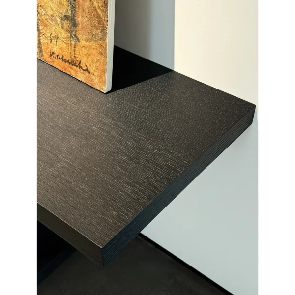 Garien Charred Black Oak Console Table in black — in a room setting