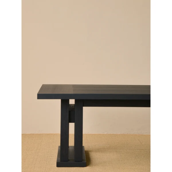 Matte Black Oak Dining Table on Multi-Post Base in black — in a room setting