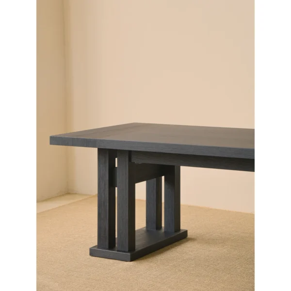 Matte Black Oak Dining Table on Multi-Post Base in black — in a room setting