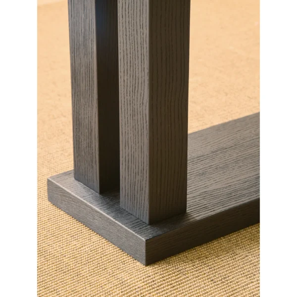 Matte Black Oak Dining Table on Multi-Post Base in black — in a room setting