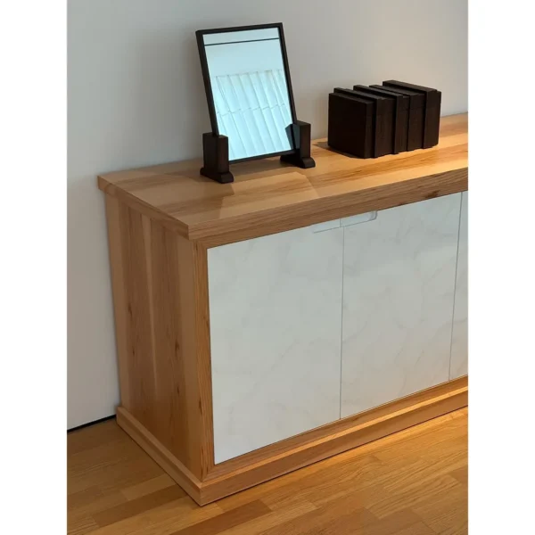 Garien Charred Oak Console Sideboard with Stone Doors in black — in a room setting