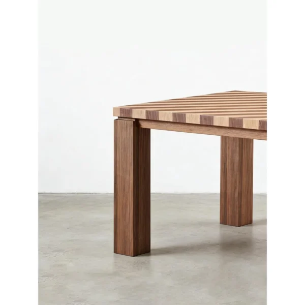 Diagonal Striped Solid Wood Dining Table in natural oak — in a room setting