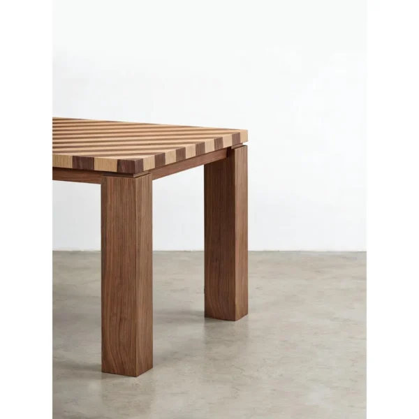 Diagonal Striped Solid Wood Dining Table in natural oak — in a room setting