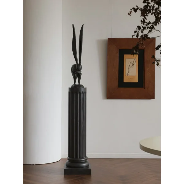 Hand-Carved Wooden Rabbit Sculpture in natural oak — in a room setting