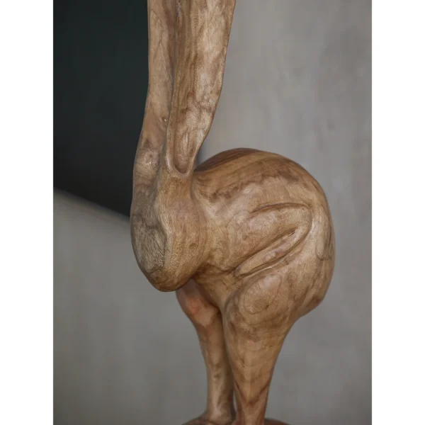 Hand-Carved Wooden Rabbit Sculpture in natural oak — in a room setting