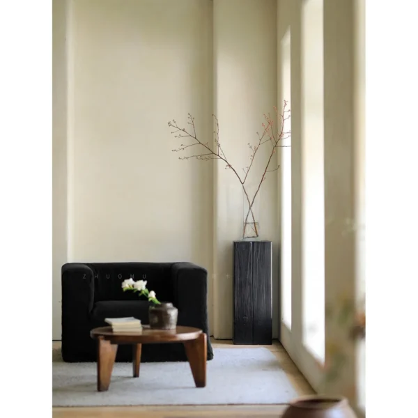 Charred Black Wood Stump Flower Pedestal in black — in a room setting
