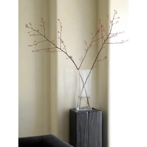 Charred Black Wood Stump Flower Pedestal in black — in a room setting