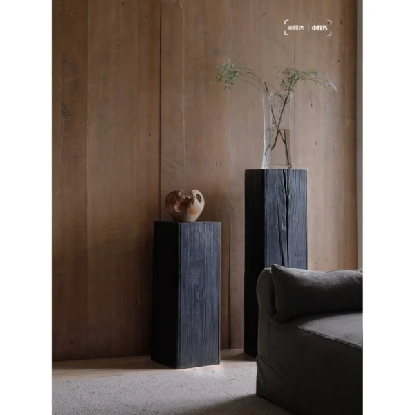 Charred Black Wood Stump Flower Pedestal in black — in a room setting