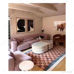 Red-Brown Checkerboard Rug with Blue and Cream Border in clay — in a room setting