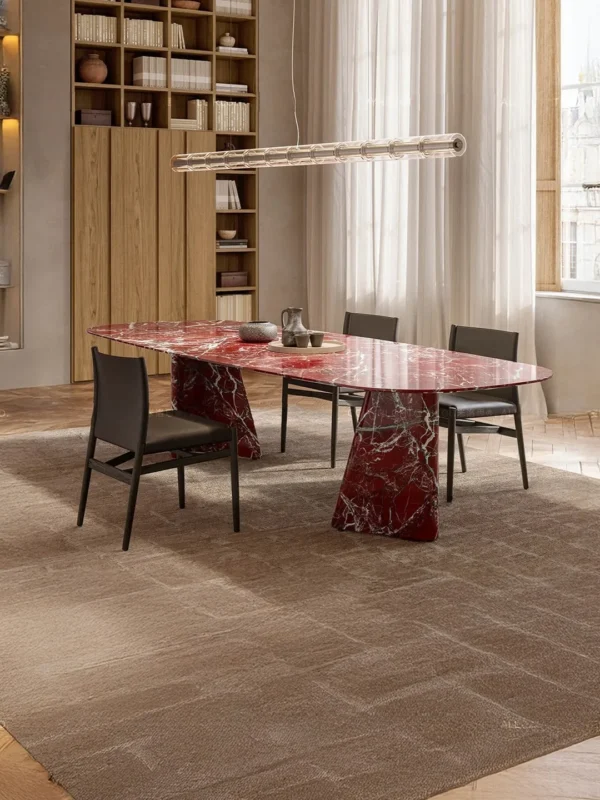 Red Marble Dining Table on Angled Stone Slabs in burgundy — in a room setting