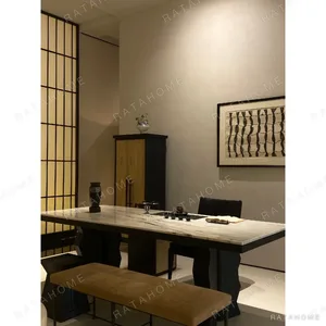Black and White Marble-Top Dining Table in black — in a room setting