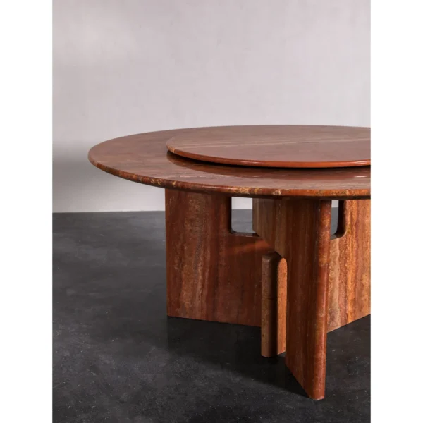 Red Travertine Round Dining Table with Lazy Susan in rust — in a room setting