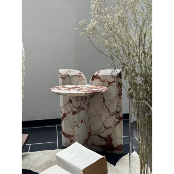 Red Veined Marble Geometric Side Table with Round Top in red — in a room setting