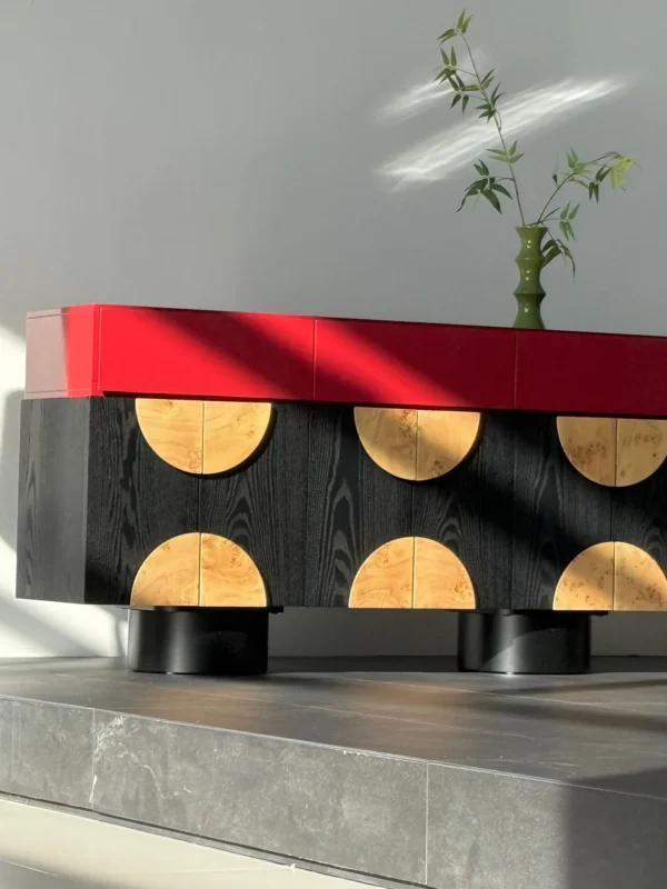 Red and Black Sideboard with Burl Half-Moon Doors in red — in a room setting