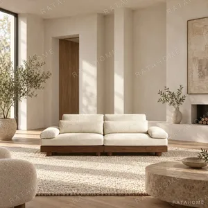Relaxed Cream Sofa with Loose Cushions on Walnut Base in oatmeal — in a room setting