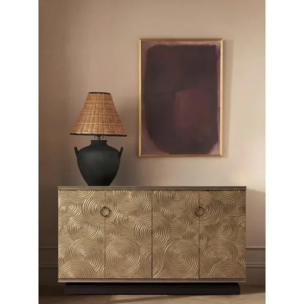 Black Walnut Sideboard with Gilded Swirl Relief Doors in brushed brass — in a room setting