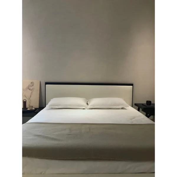 Restrained Oak-Framed Leather Bed in White — in a room setting
