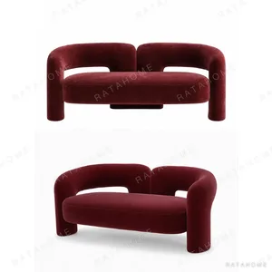 Retro Butterfly-Arm Curved Loveseat in Burgundy Fabric — in a room setting