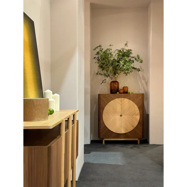Reunion Cabinet in Walnut and Oak Marquetry with Round Motif — in a room setting