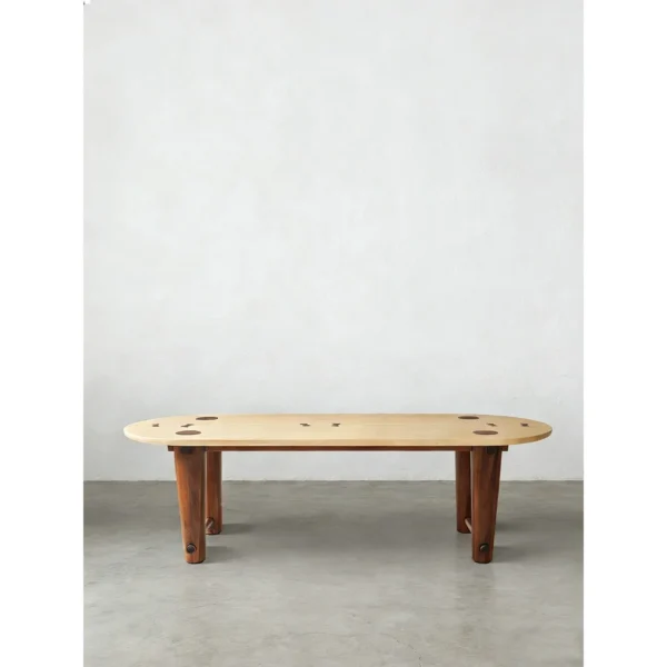 Rhye Oak Oval Dining Table with Inlaid Leg Joints in natural oak — in a room setting