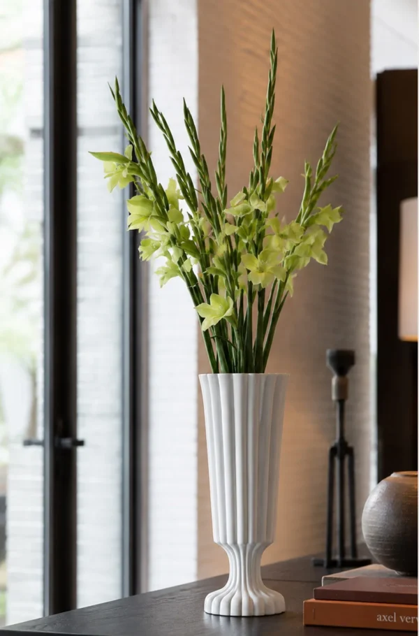 Hand-Made Ribbed Matte White Flared Ceramic Vase in ivory — in a room setting