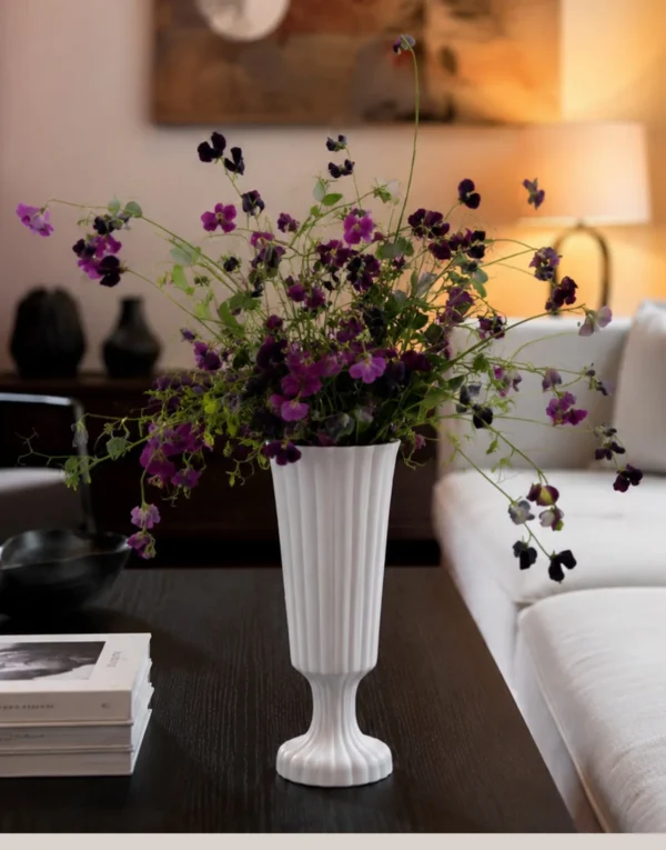 Hand-Made Ribbed Matte White Flared Ceramic Vase in ivory — in a room setting