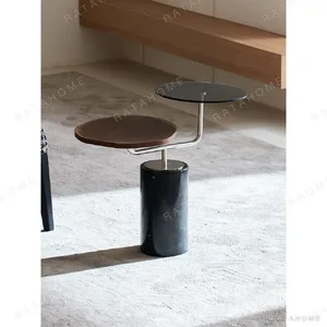 Mid-Century Two-Tier Side Table on Black Marble Base in black — in a room setting