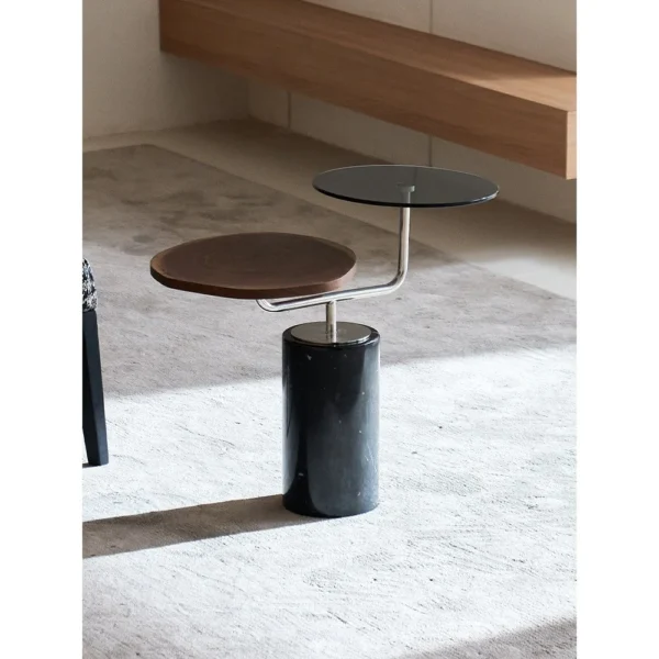 Mid-Century Two-Tier Side Table on Black Marble Base in black — in a room setting