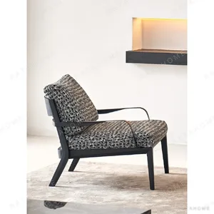 Mid-Century Two-Tier Side Table on Black Marble Base in black — in a room setting