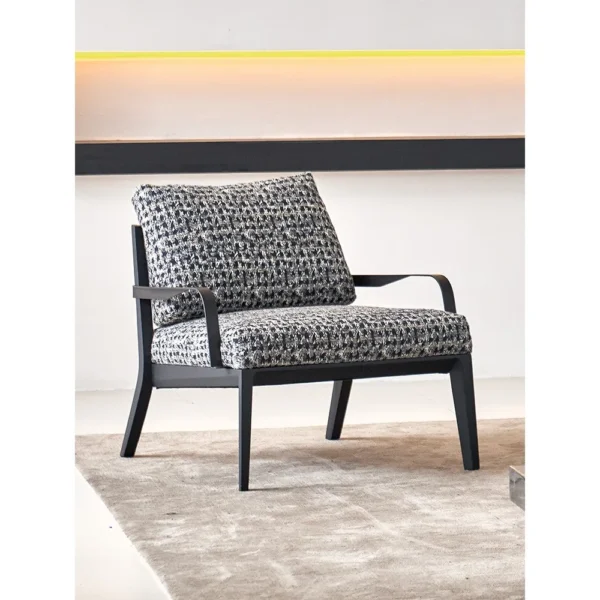Mid-Century Two-Tier Side Table on Black Marble Base in black — in a room setting